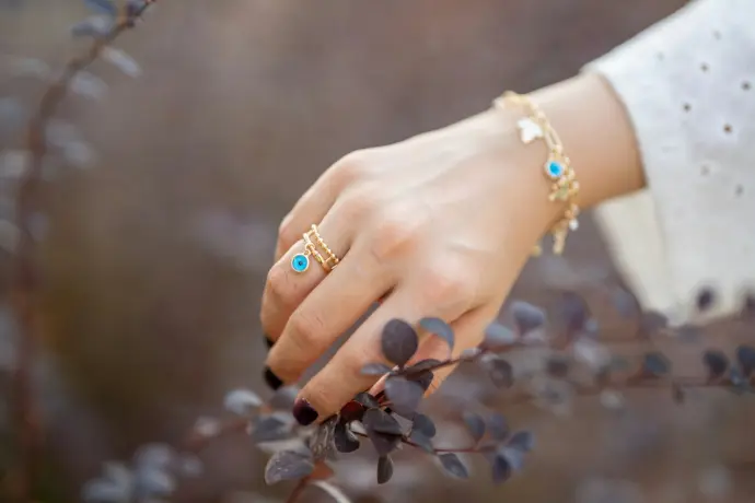 a woman's hand with a bracelet on it